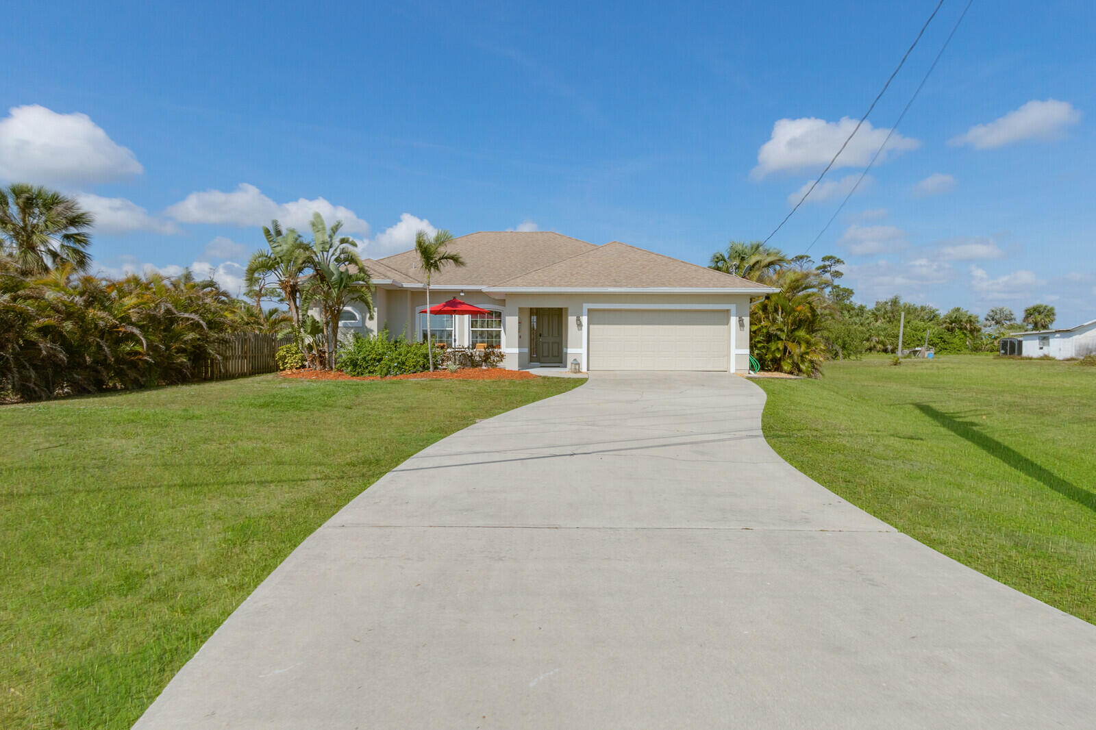 4320 S Highway Grant, FL 32949 - Photo 3 of 76 a front view of a house with a yard