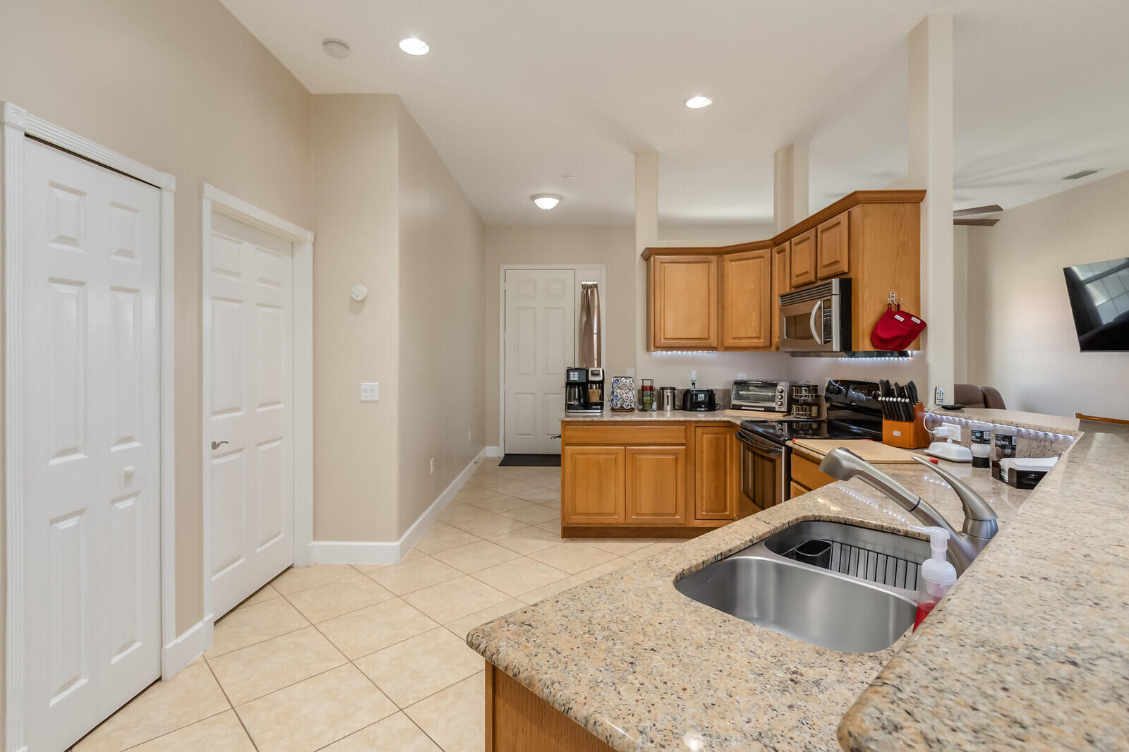 4320 S Highway Grant, FL 32949 - Photo 32 of 76 a kitchen with stainless steel appliances granite countertop a sink and a refrigerator