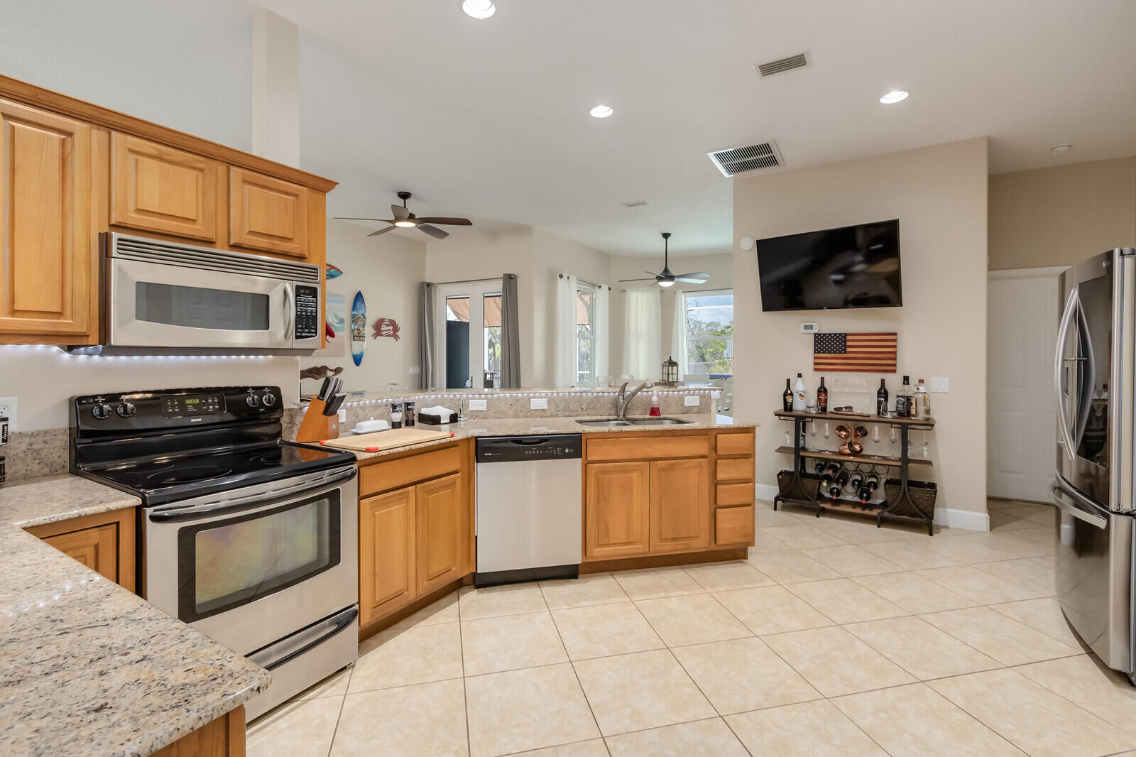 4320 S Highway Grant, FL 32949 - Photo 34 of 76 a kitchen with stainless steel appliances granite countertop a stove and a sink