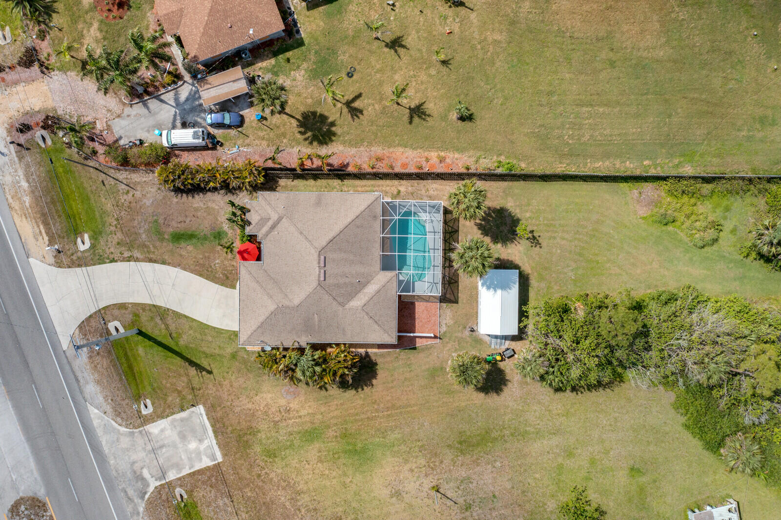 4320 S Highway Grant, FL 32949 - Photo 36 of 76 an aerial view of a house with a garden