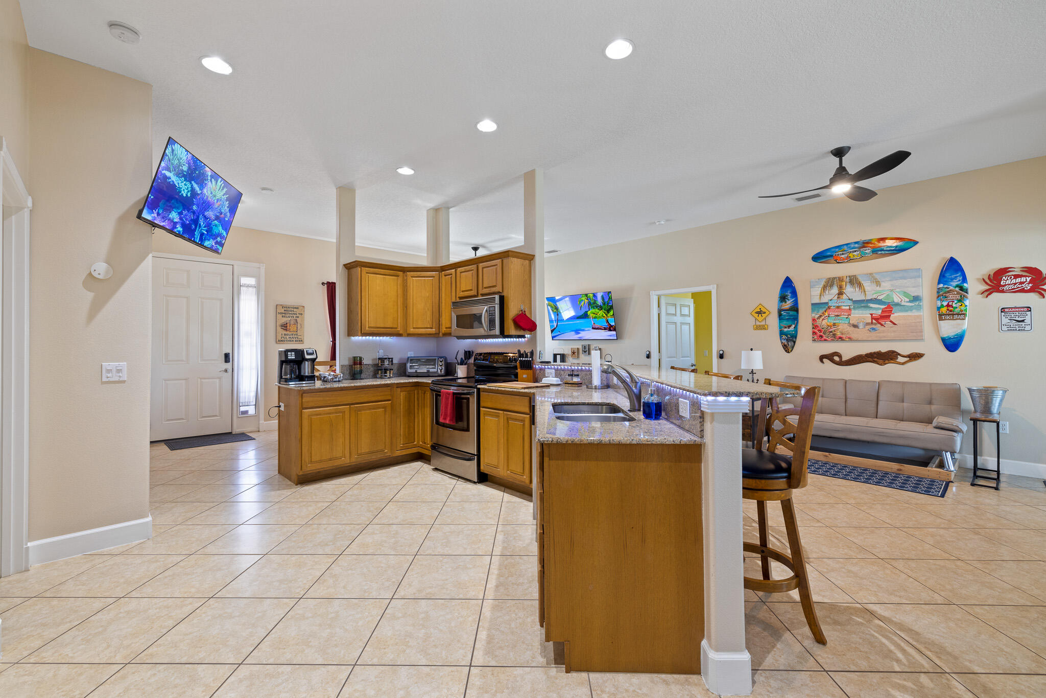 4320 S Highway Grant, FL 32949 - Photo 46 of 76 a kitchen with stainless steel appliances granite countertop a refrigerator and a stove top oven