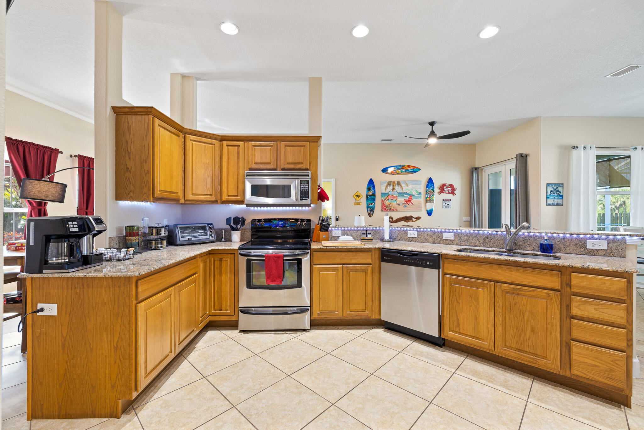 4320 S Highway Grant, FL 32949 - Photo 47 of 76 a large kitchen with stainless steel appliances granite countertop a sink and cabinets