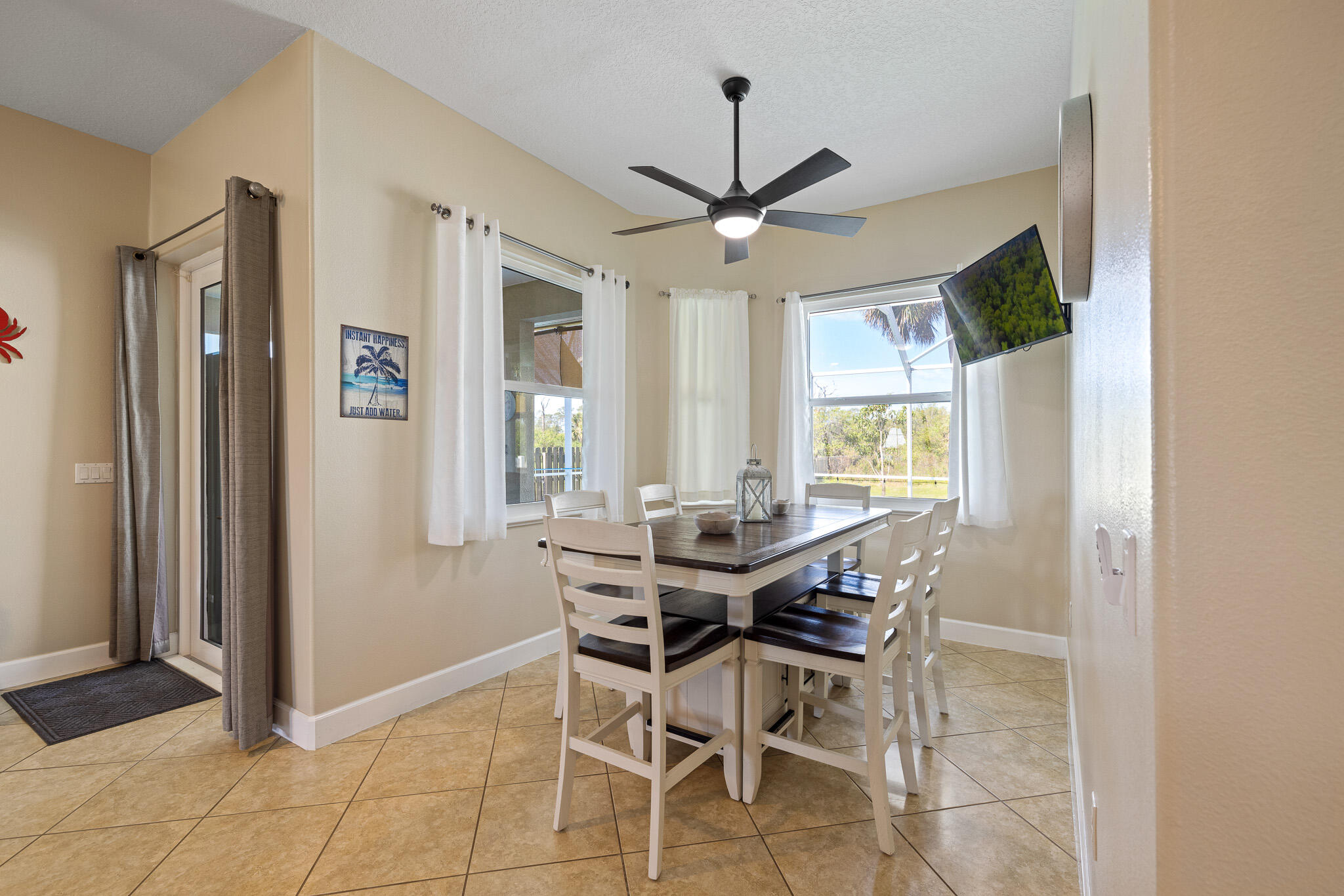 4320 S Highway Grant, FL 32949 - Photo 49 of 76 a view of a dining room with furniture and a window
