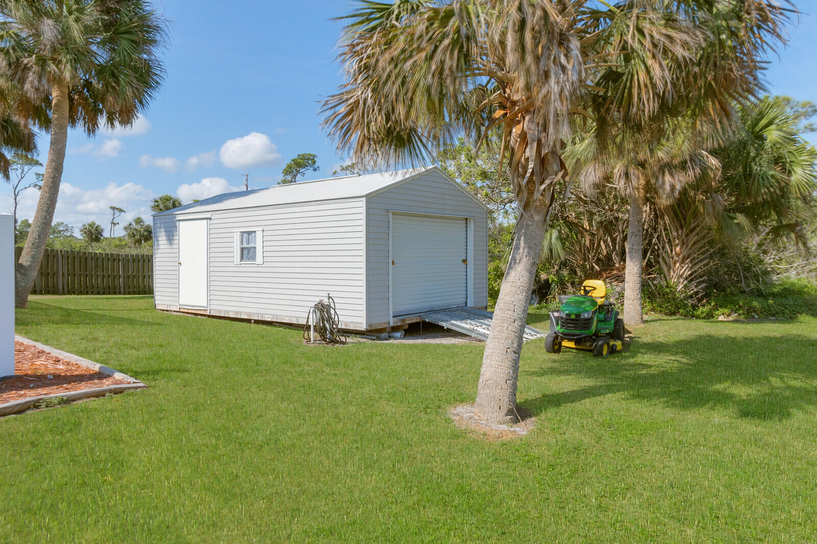 4320 S Highway Grant, FL 32949 - Photo 5 of 76 a front view of a house with garden