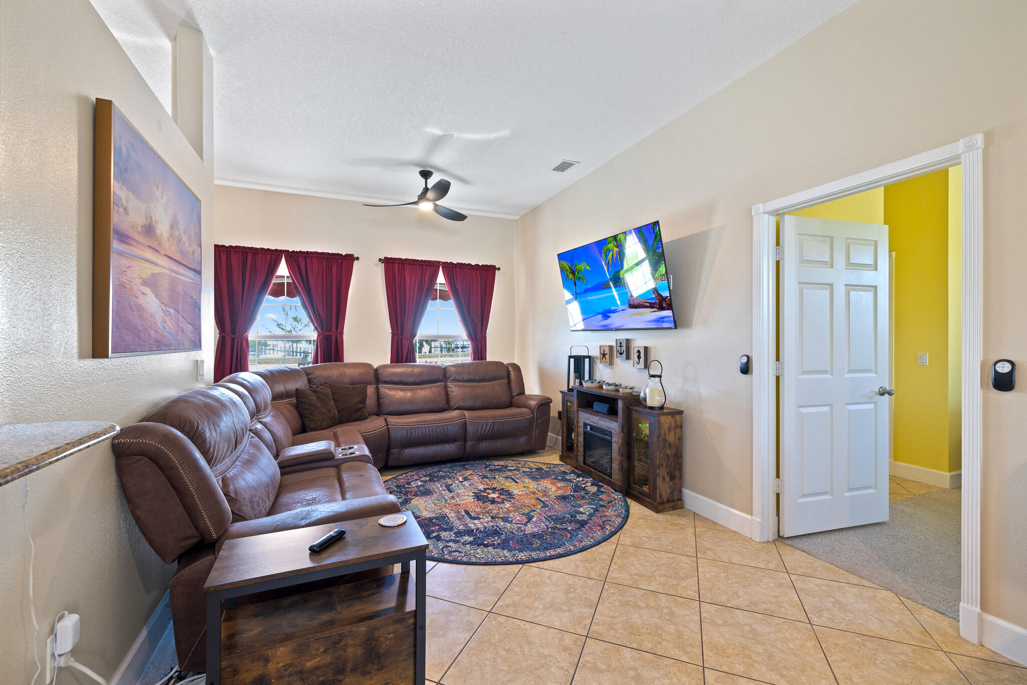 4320 S Highway Grant, FL 32949 - Photo 52 of 76 a living room with furniture and a flat screen tv