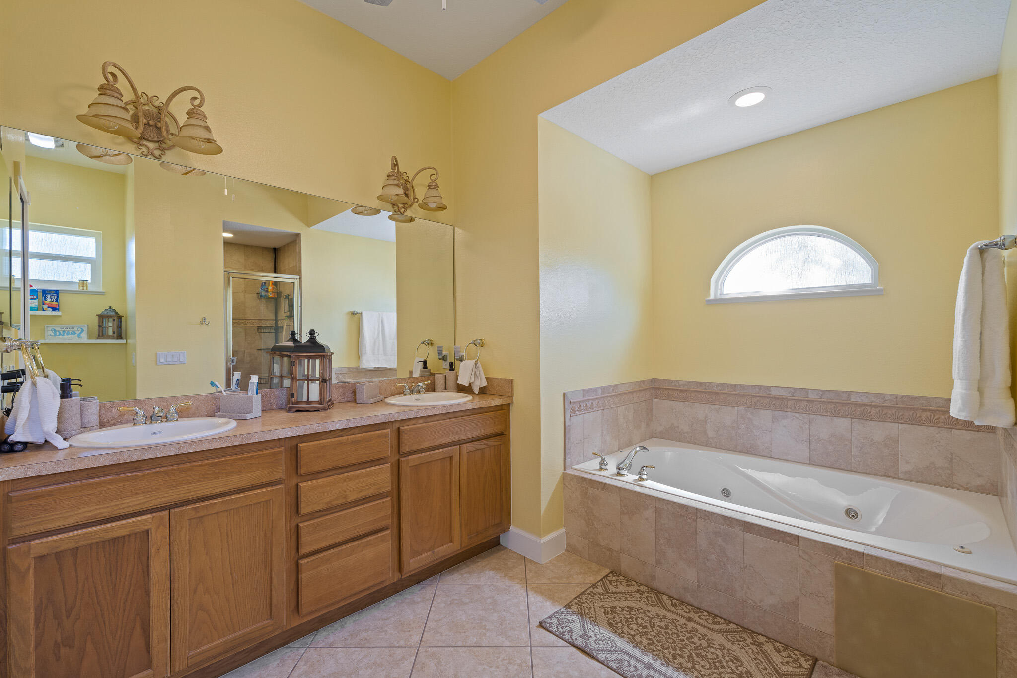 4320 S Highway Grant, FL 32949 - Photo 56 of 76 a bathroom with a tub sink and mirror