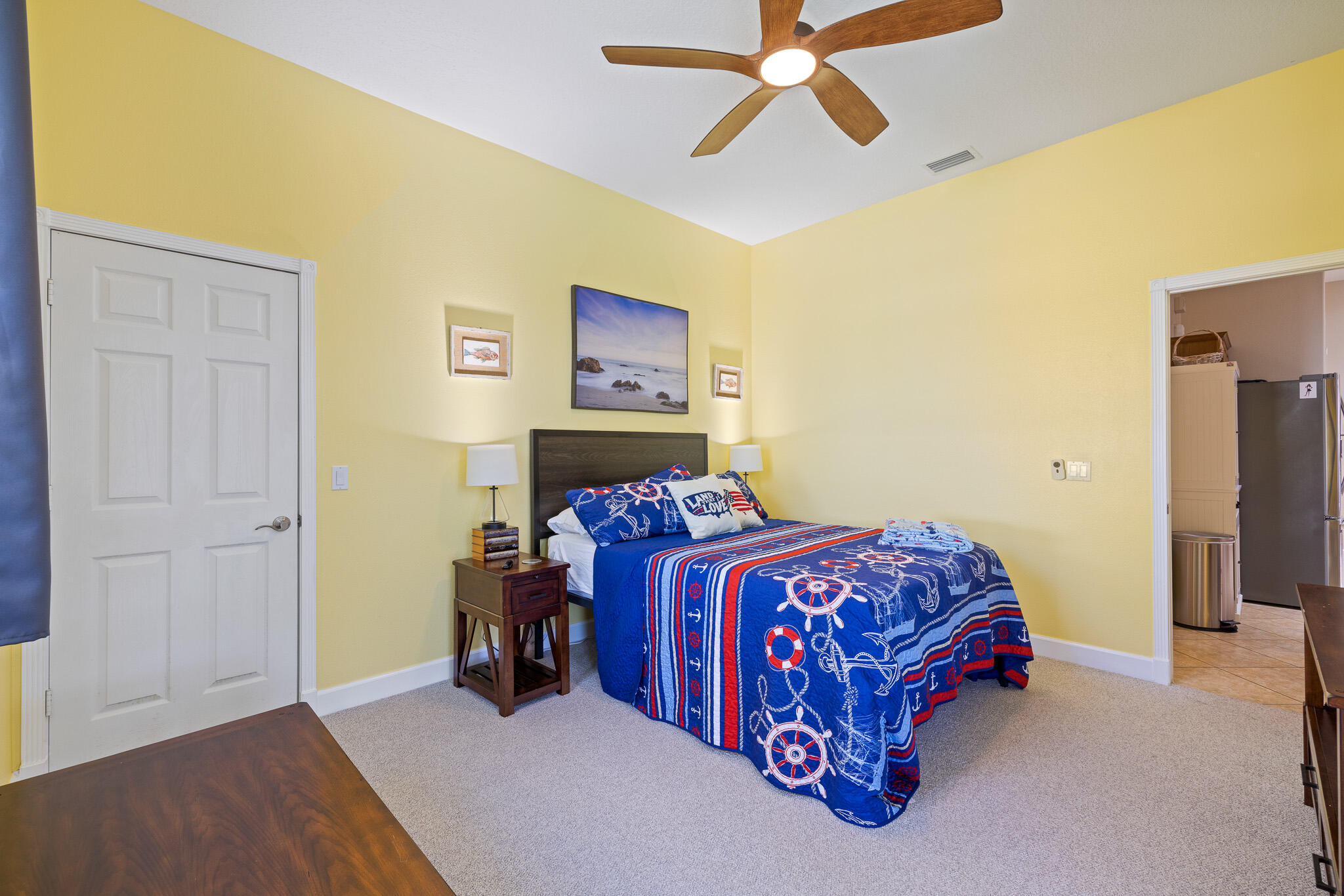 4320 S Highway Grant, FL 32949 - Photo 59 of 76 a bed room with a bed and a ceiling fan