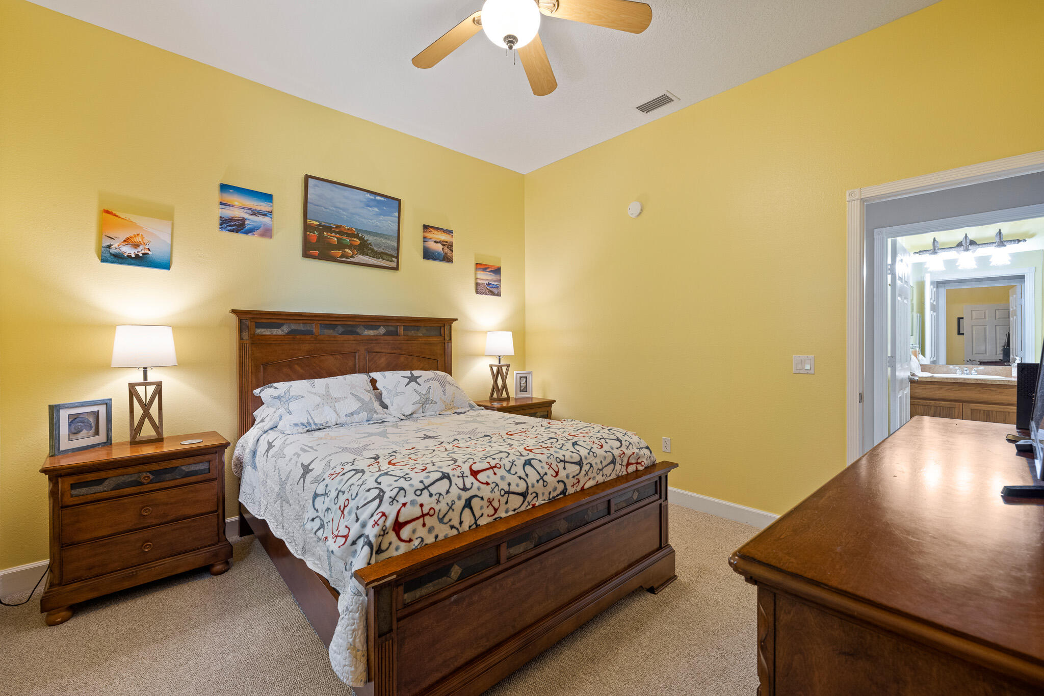 4320 S Highway Grant, FL 32949 - Photo 61 of 76 a bedroom with a bed and a lamp on table