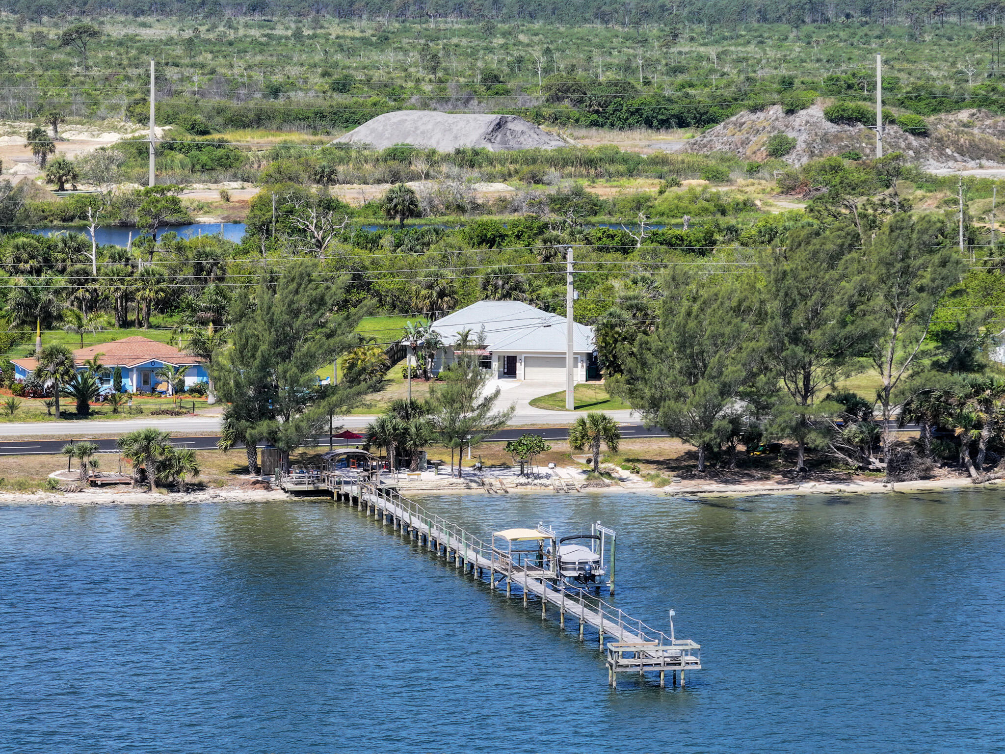 4320 S Highway Grant, FL 32949 - Photo 64 of 76 an aerial view of a house with a lake view