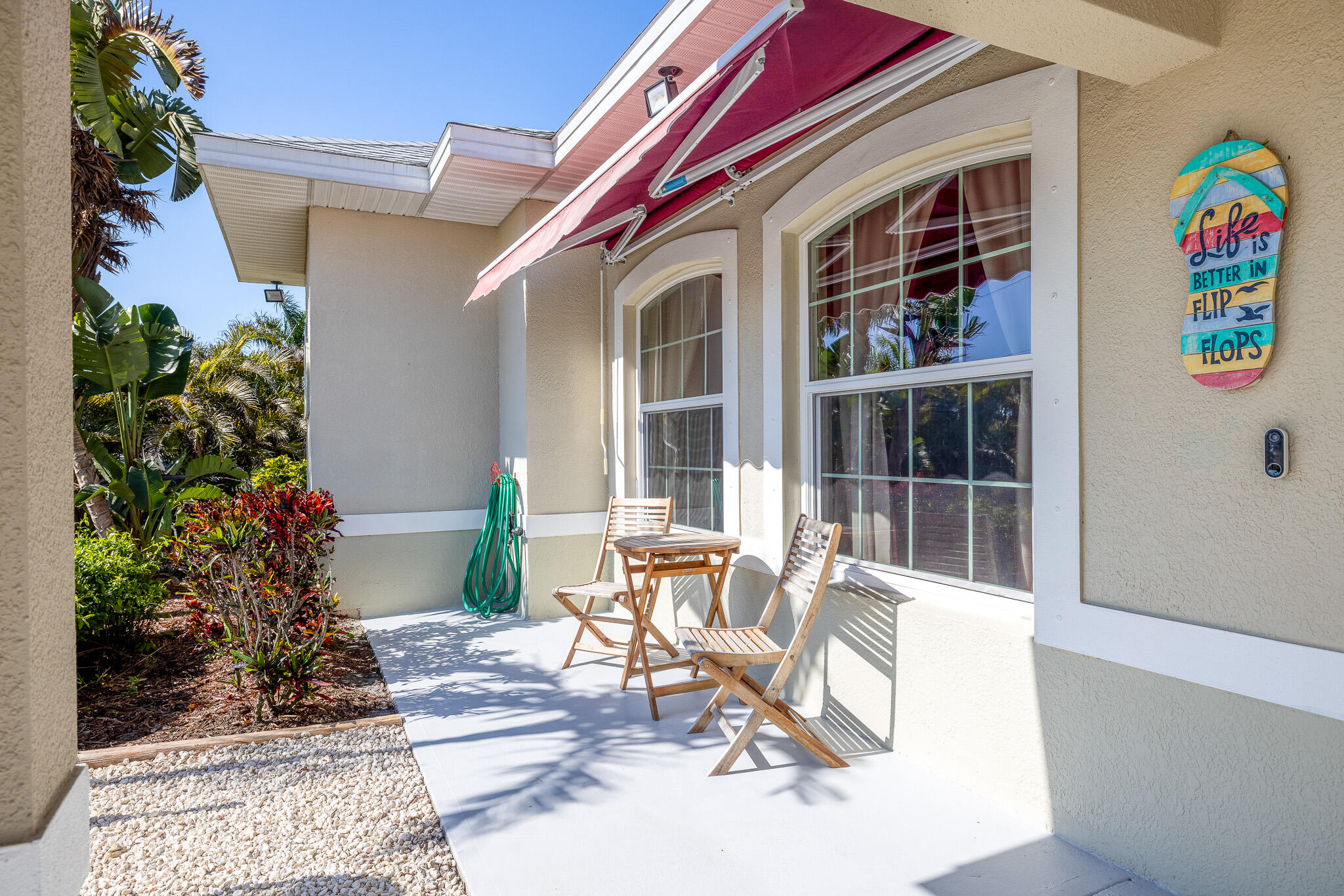 4320 S Highway Grant, FL 32949 - Photo 67 of 76 a building outdoor space with patio furniture and potted plants