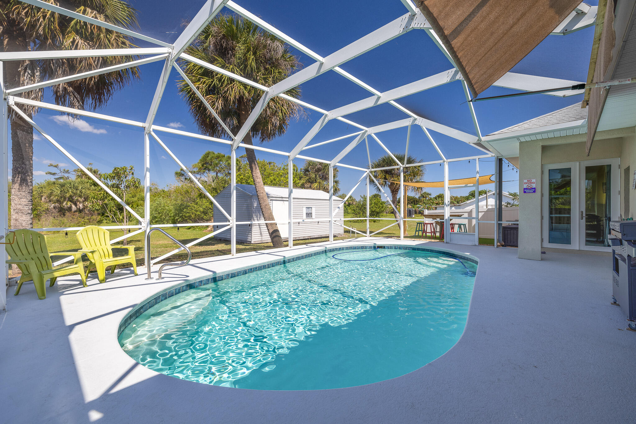 4320 S Highway Grant, FL 32949 - Photo 69 of 76 a view of a backyard with table and chairs