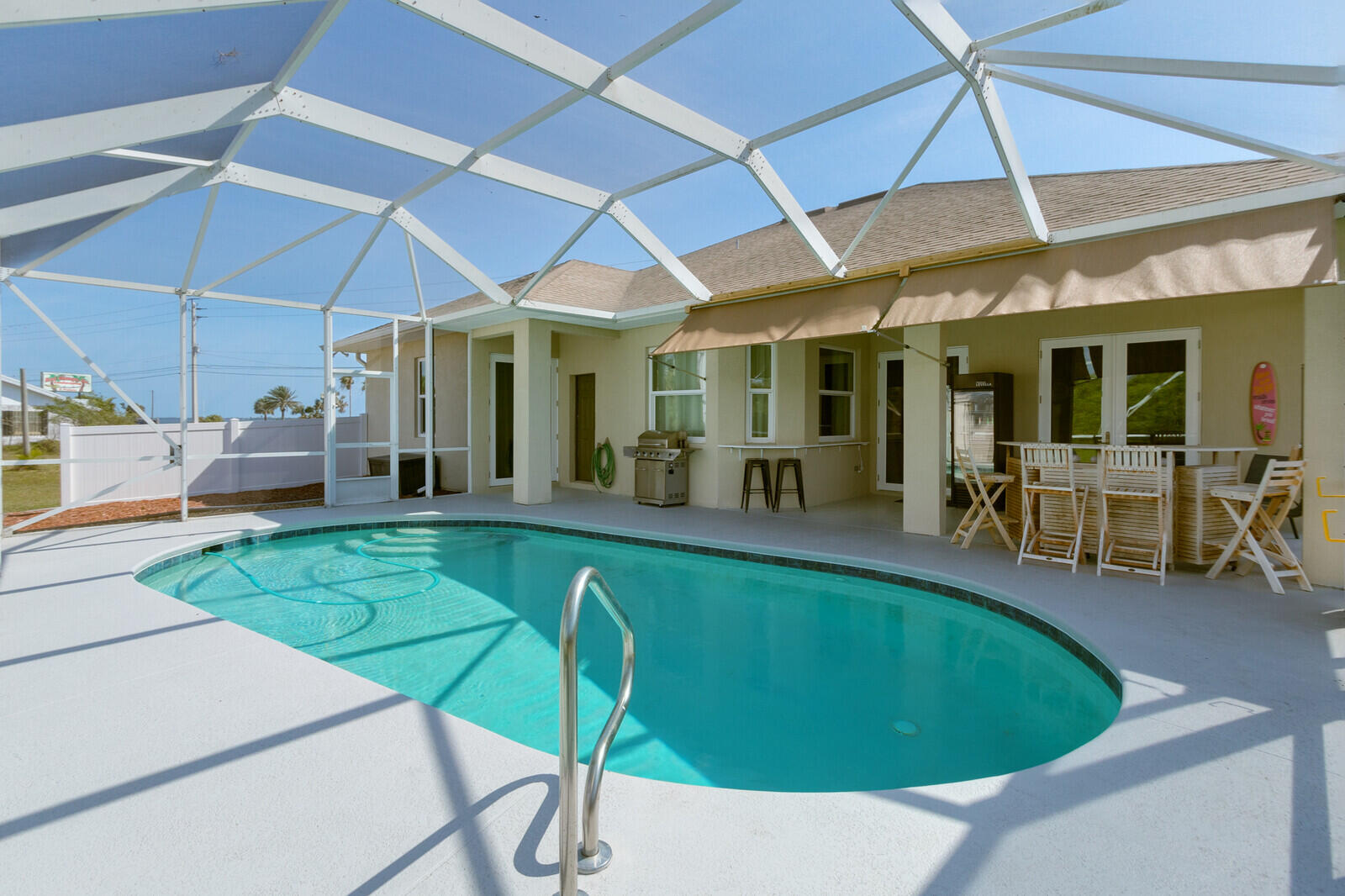 4320 S Highway Grant, FL 32949 - Photo 10 of 76 a view of a patio with table and chairs under an umbrella