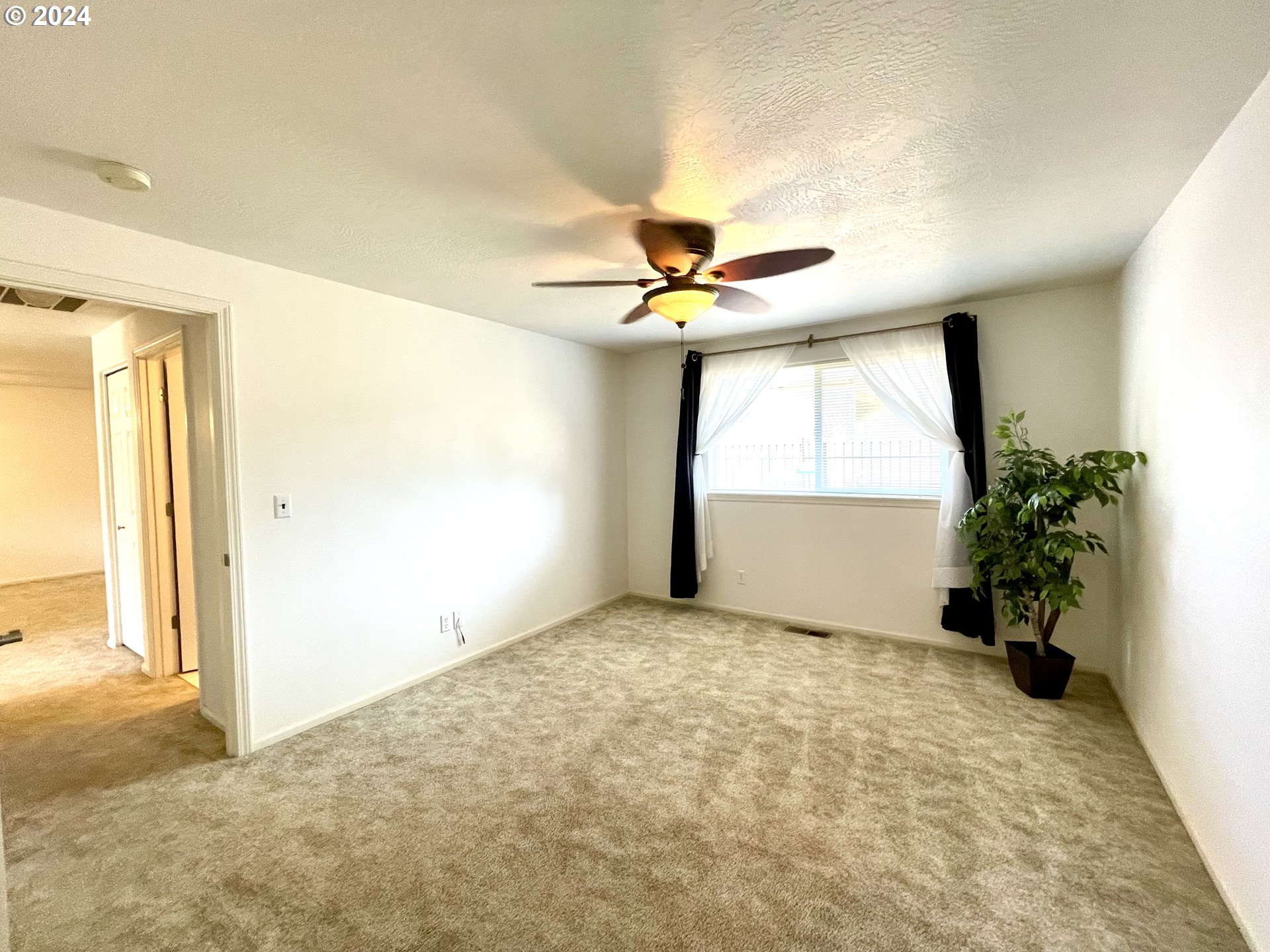 968 West L Street Springfield, OR 97477 - Photo 11 of 21 a view of workspace with window and a ceiling fan