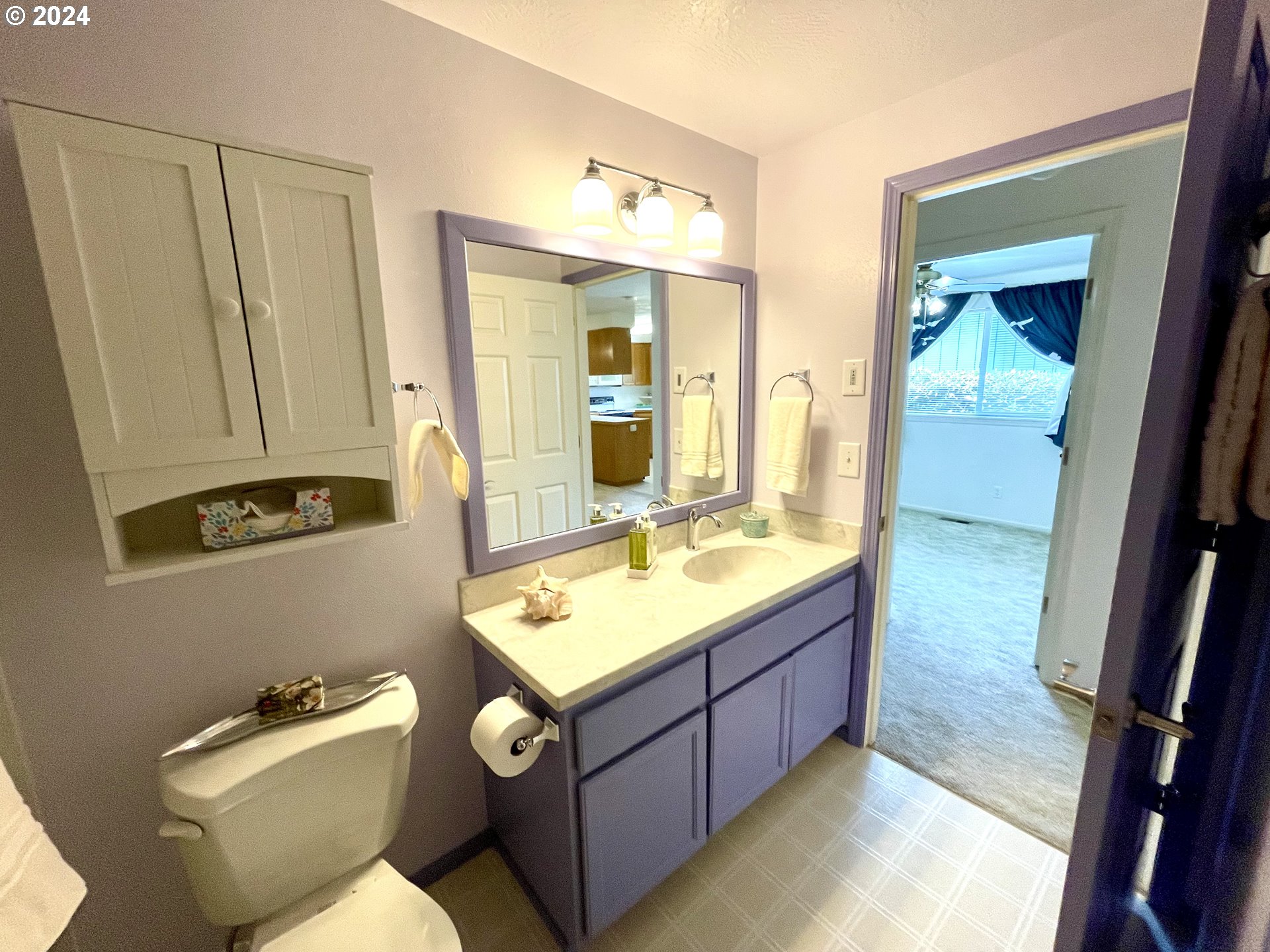 968 West L Street Springfield, OR 97477 - Photo 15 of 21 a bathroom with a granite countertop sink and a mirror