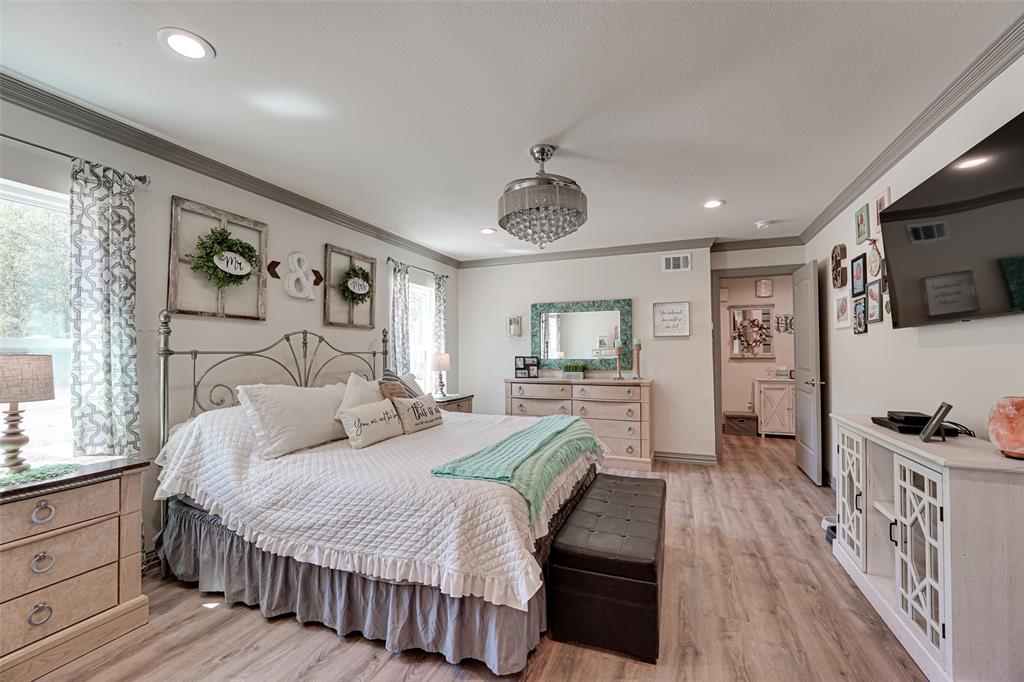 521 Bakers Branch Road Waxahachie, TX 75167 - Photo 21 of 37 Spacious bedroom featuring wood-finish flooring, recessed lighting, and crown molding