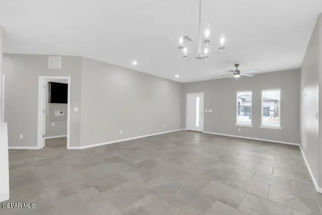 a view of kitchen with stainless steel appliances kitchen island a sink and a refrigerator