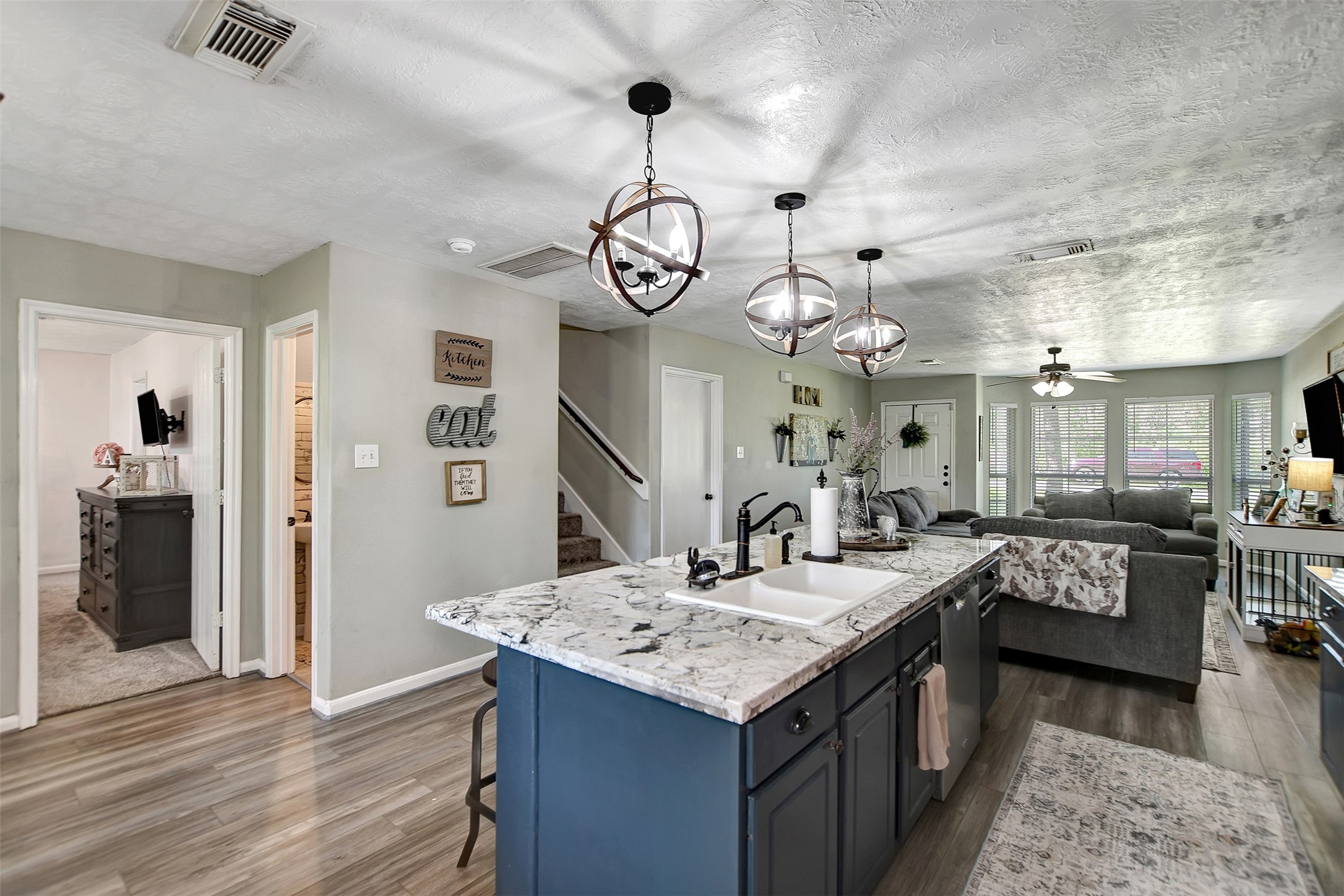 25401 Hunting Trail Magnolia, TX 77355 - Photo 15 of 42 a kitchen with a table chairs and chandelier