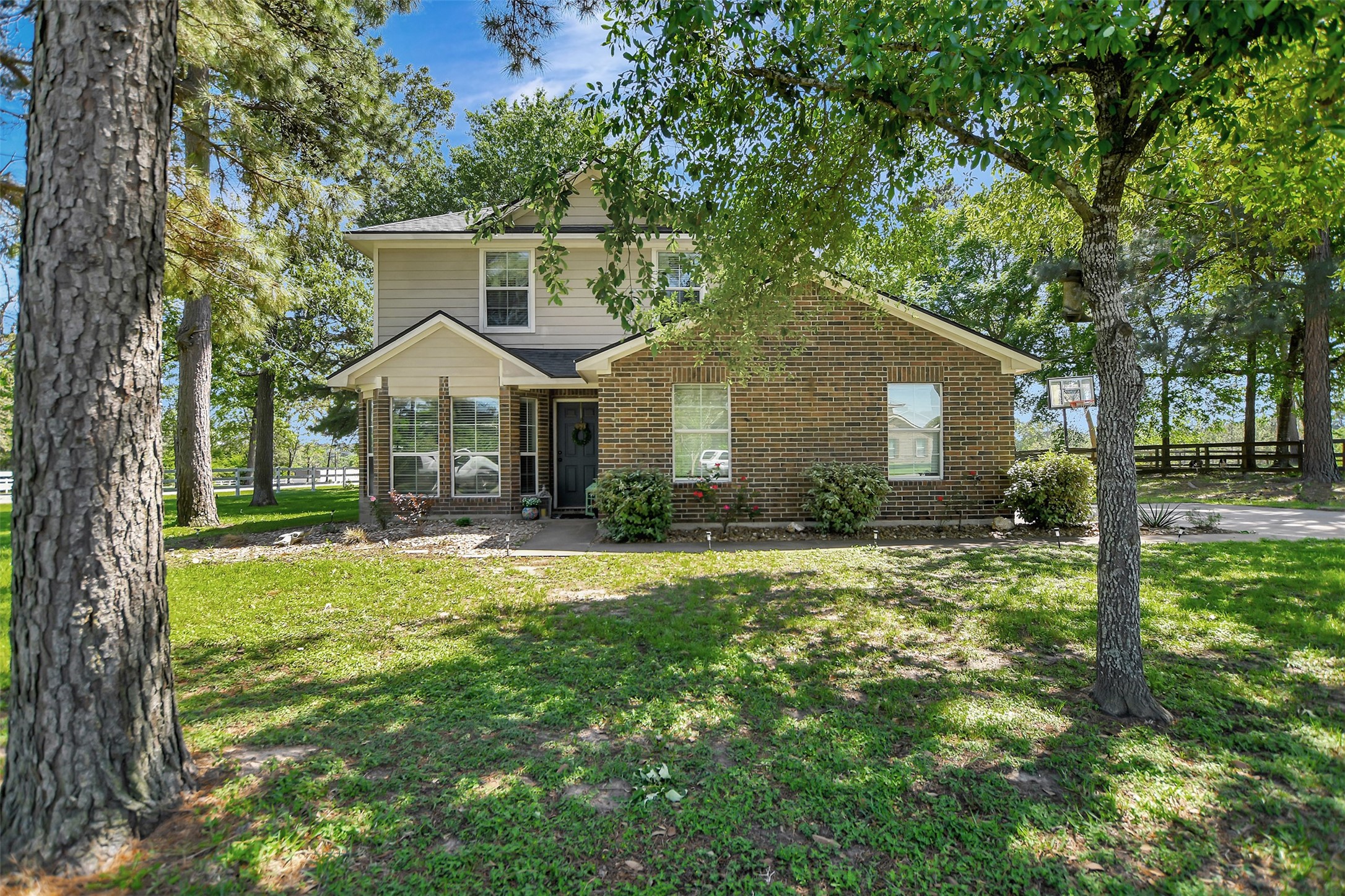 25401 Hunting Trail Magnolia, TX 77355 - Photo 3 of 42 a front view of house with yard and green space