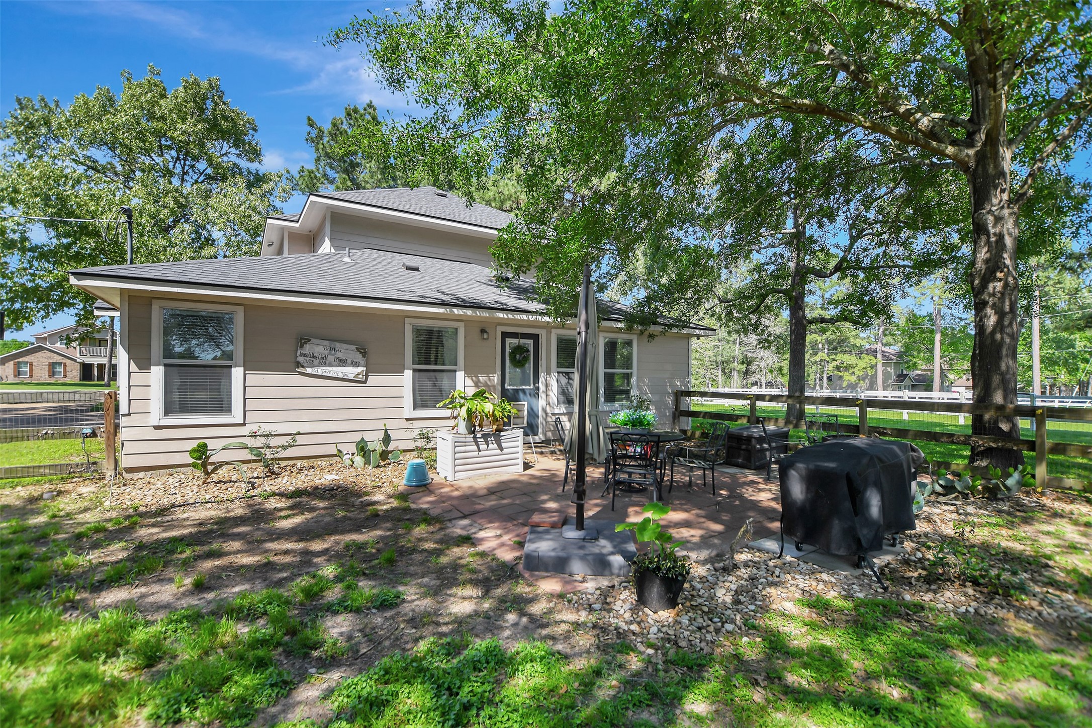 25401 Hunting Trail Magnolia, TX 77355 - Photo 38 of 42 a front view of a house with sitting area and garden
