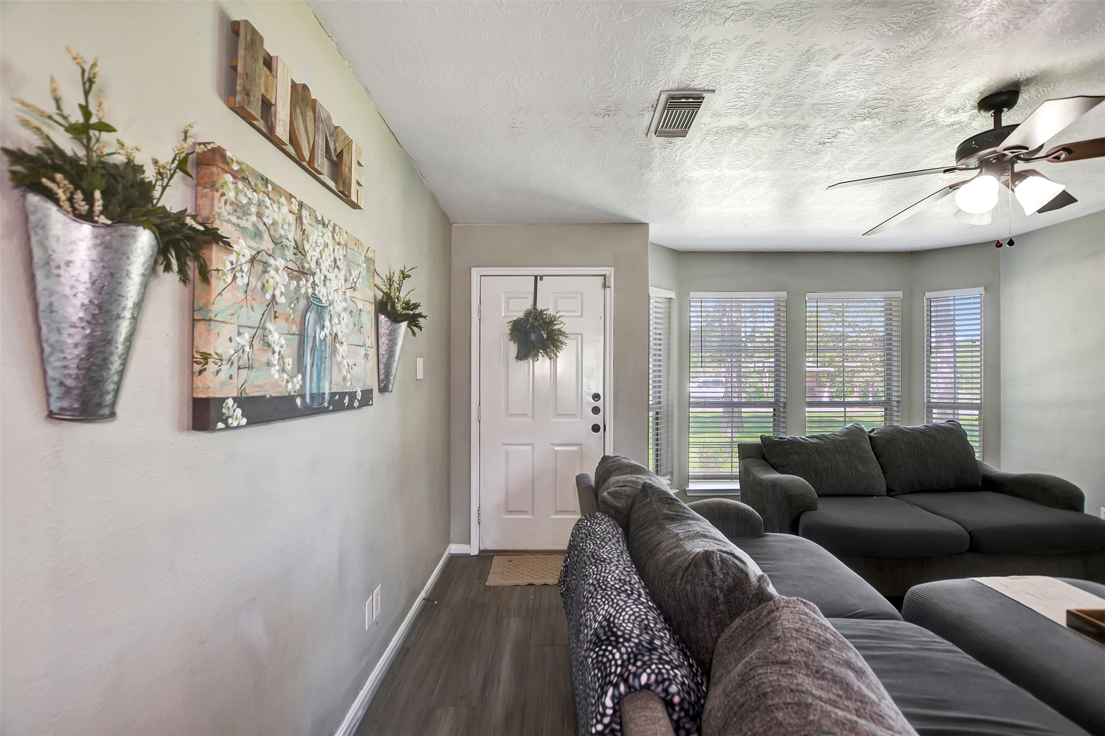 25401 Hunting Trail Magnolia, TX 77355 - Photo 6 of 42 a living room with furniture and a large window
