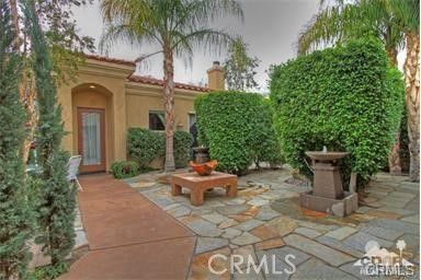 a view of a chair and table in the patio