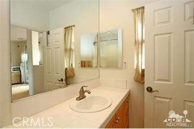 a bathroom with a sink and a mirror