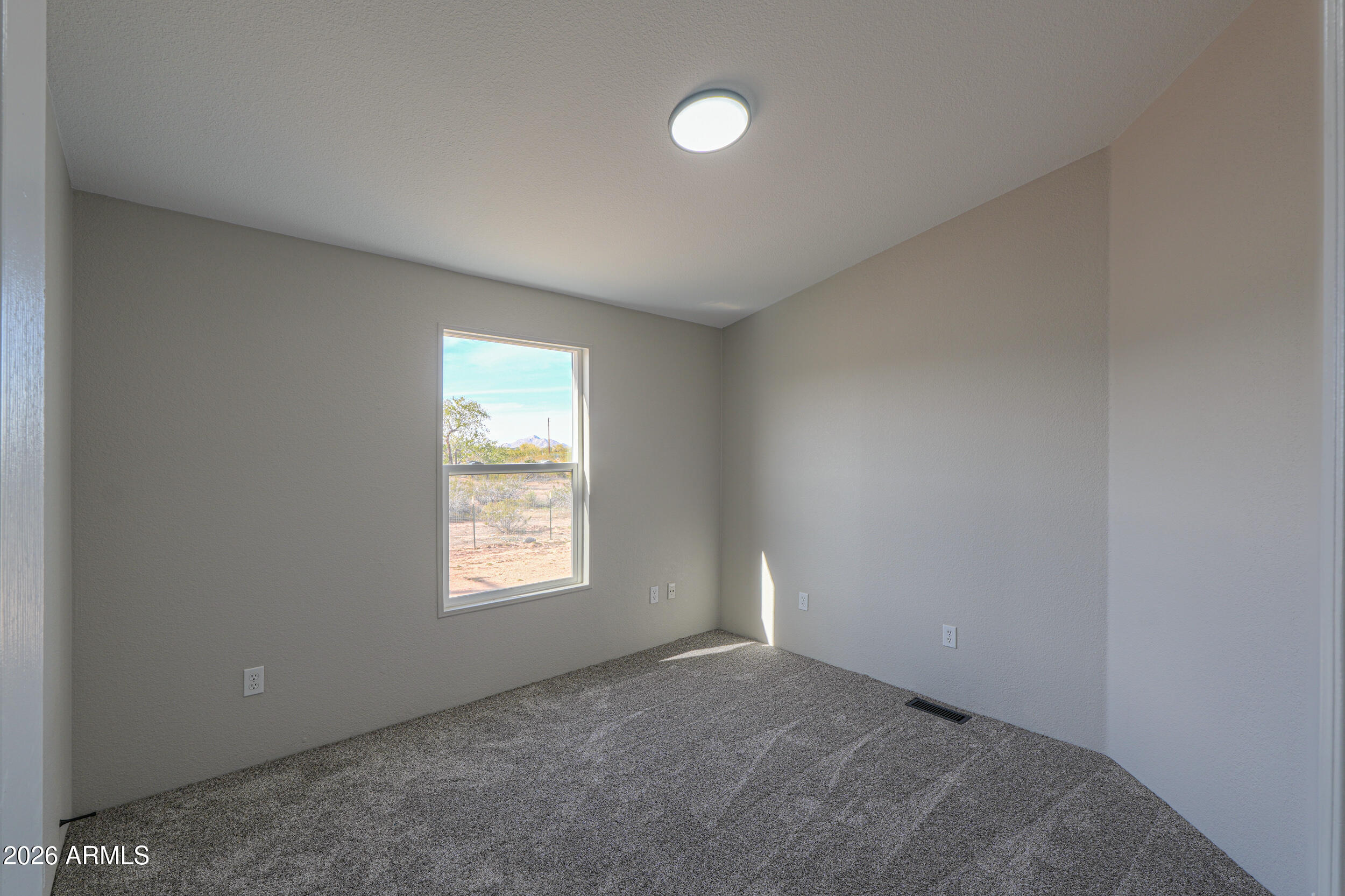 161 North Pueblo Road Maricopa, AZ 85139 - Photo 34 of 79 a view of an empty room and window