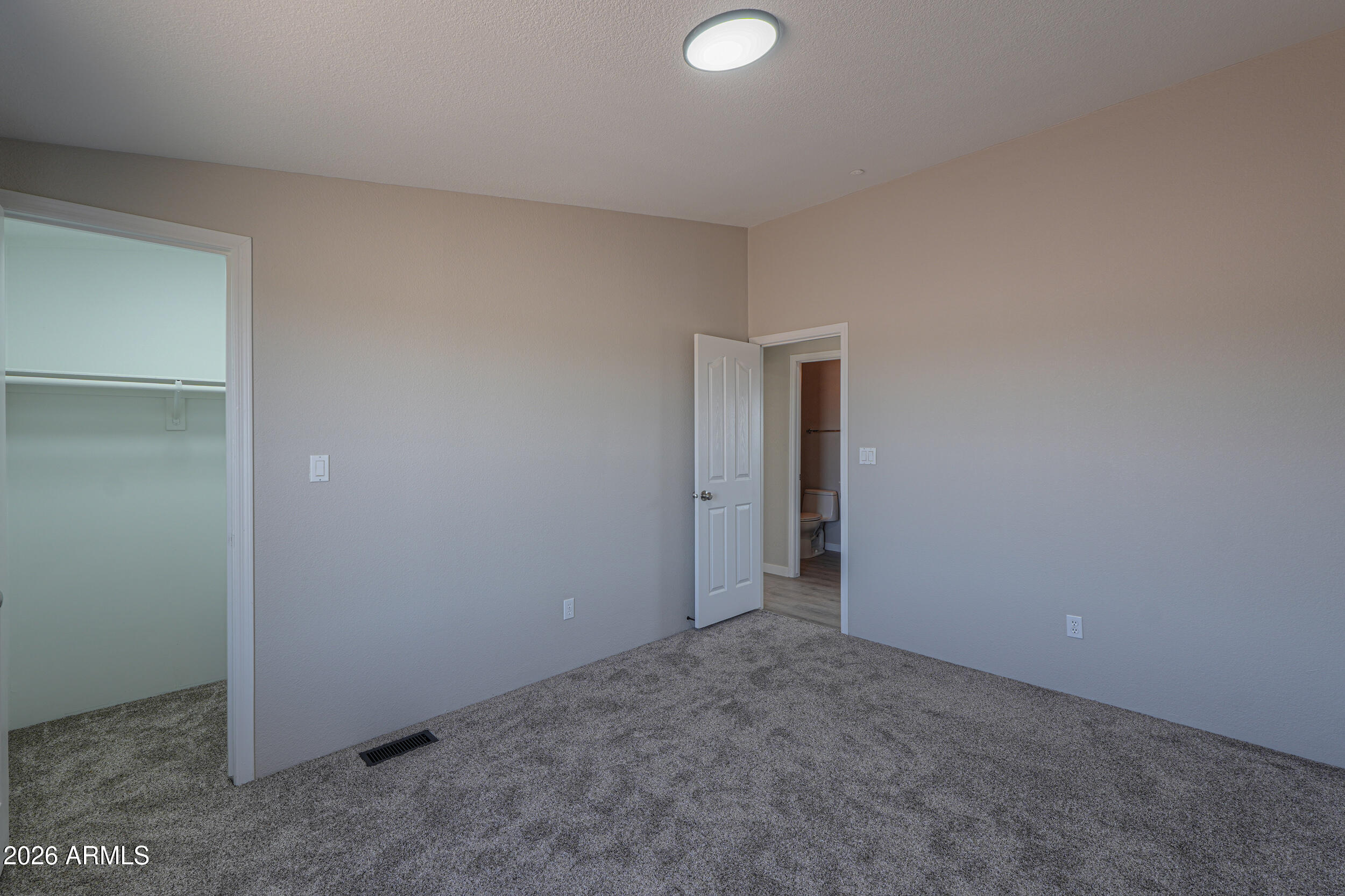 161 North Pueblo Road Maricopa, AZ 85139 - Photo 39 of 79 a view of an empty room and closet area