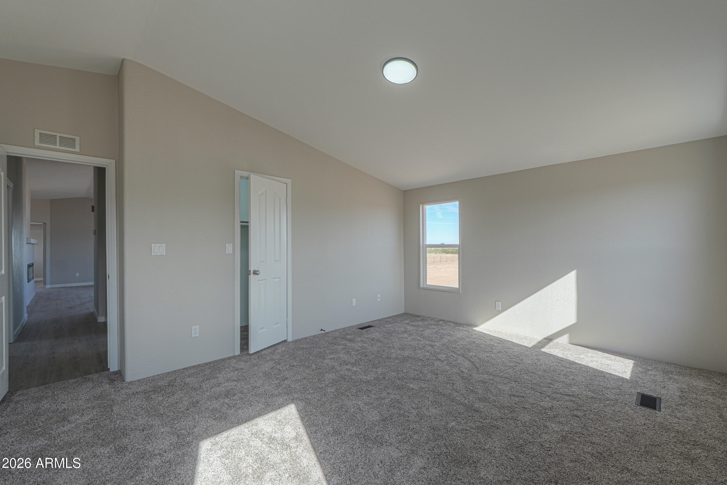161 North Pueblo Road Maricopa, AZ 85139 - Photo 43 of 79 an empty room with windows and closet