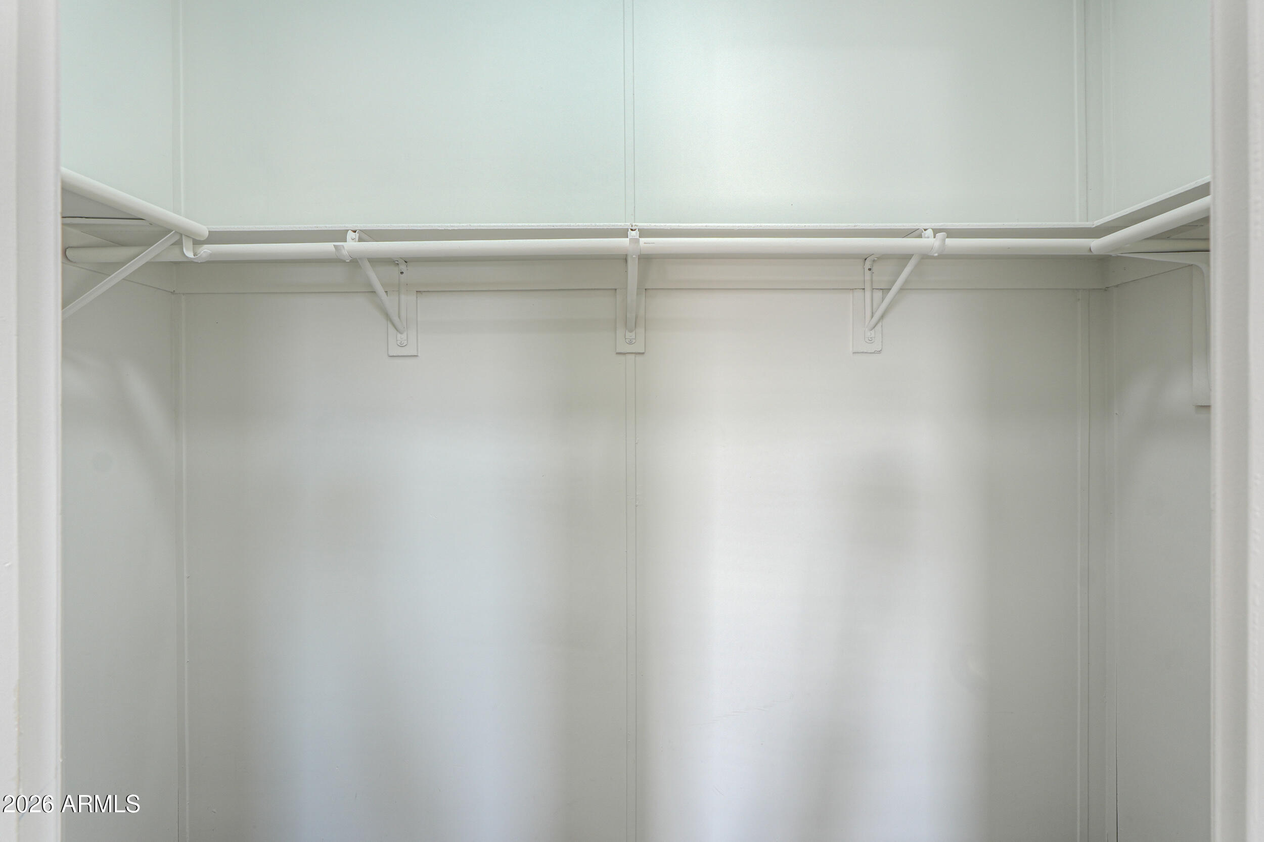 161 North Pueblo Road Maricopa, AZ 85139 - Photo 46 of 79 a view of a room with racks on the wall