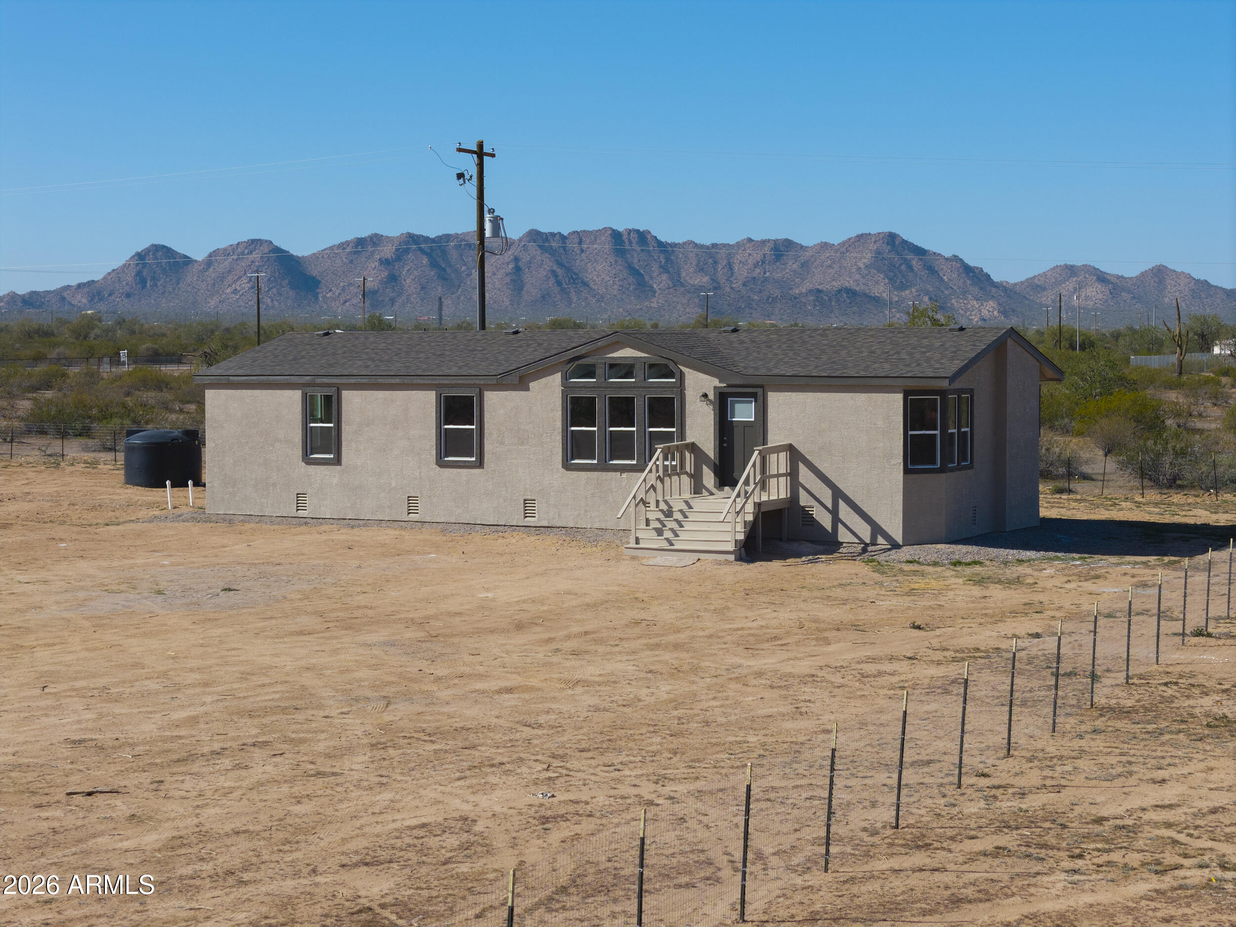 161 North Pueblo Road Maricopa, AZ 85139 - Photo 75 of 79 a front view of a house with trees