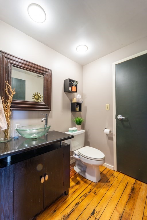 1 Envelope Terrace, Unit 309 Worcester, MA 01604 - Photo 15 of 18 a bathroom with a granite countertop toilet sink and mirror