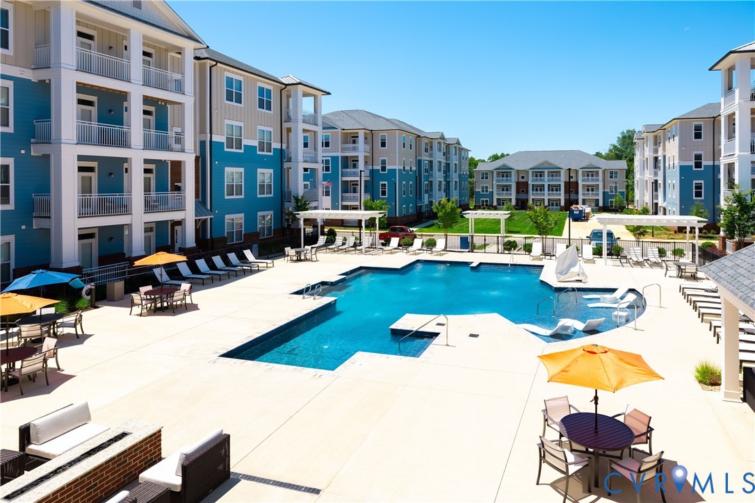 Community pool featuring a patio area and outdoor
