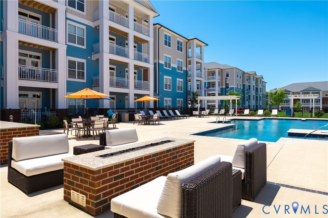 10525 Stony Blf Drive, Unit 201 Ashland, VA 23005 - Photo 3 of 35 Community pool with a patio area