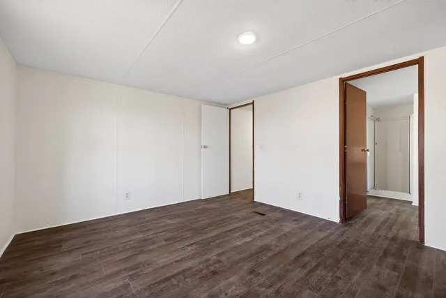 a bathroom with a double vanity sink a mirror and a bathtub