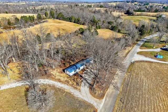 an aerial view of beach and residential houses with outdoor space