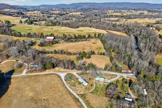 an aerial view of house with yard