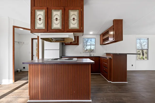 a kitchen with stainless steel appliances granite countertop a stove and a refrigerator