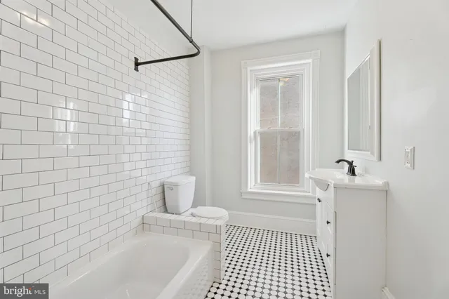 a bathroom with a bathtub and shower