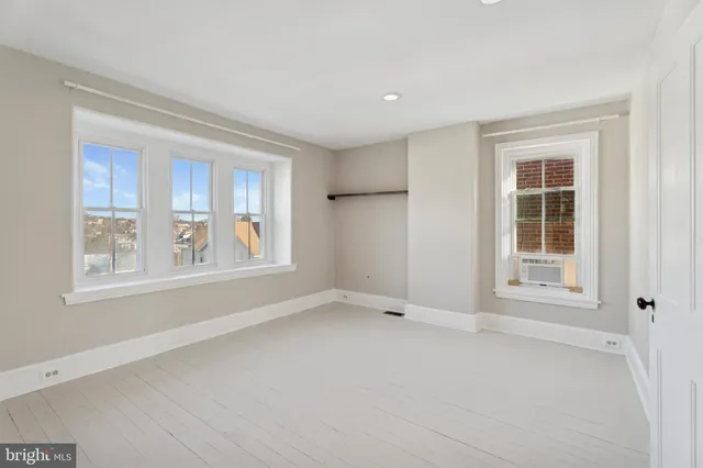 an empty room with windows