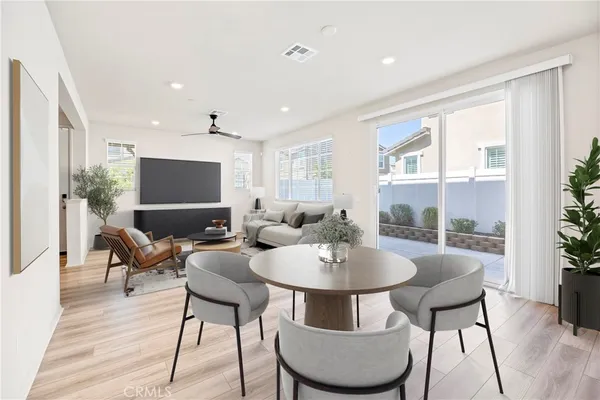 a view of a dining room with furniture window and wooden floor