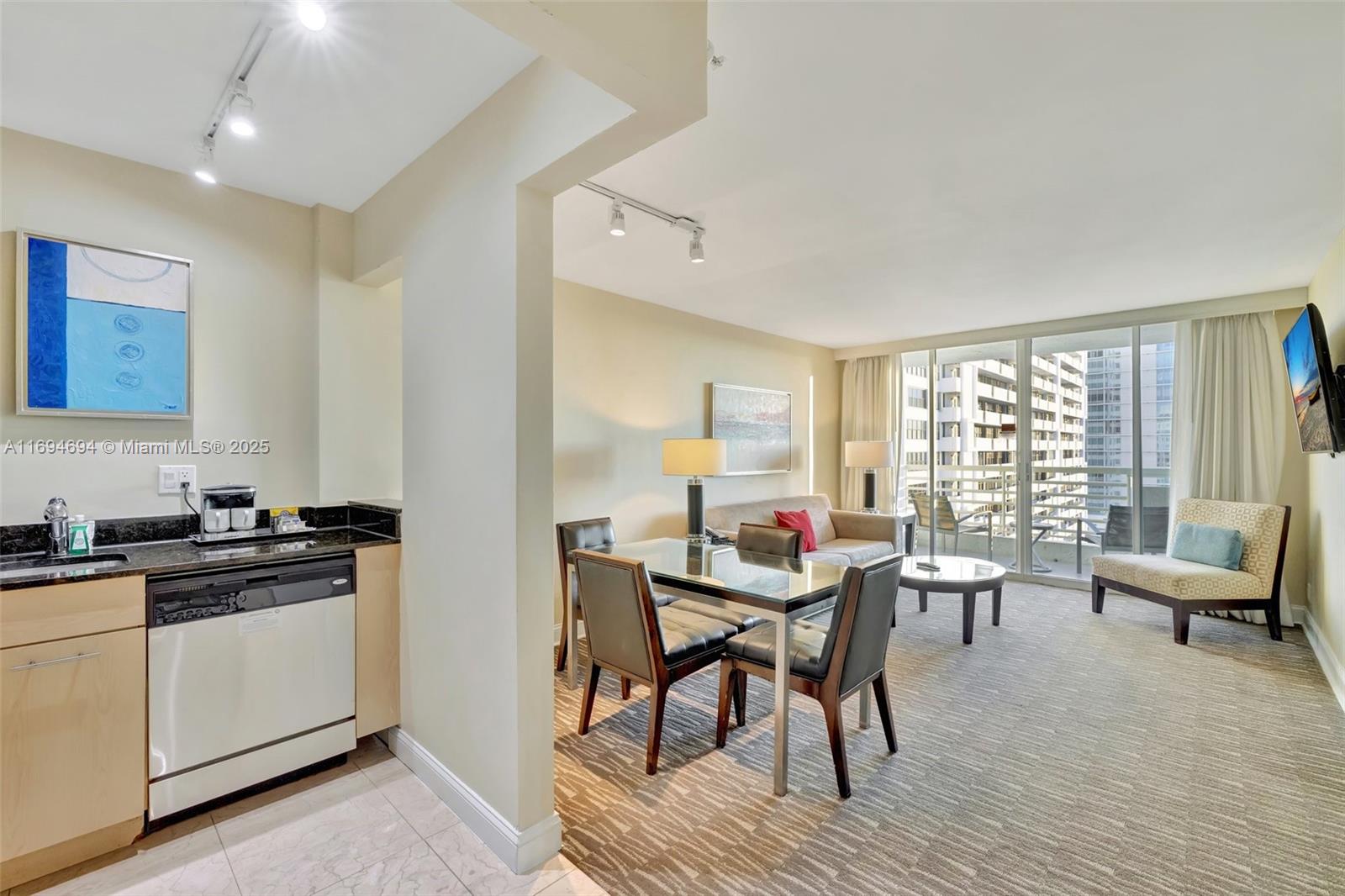 2670 East Sunrise Boulevard, Unit 905 Fort Lauderdale, FL 33304 - Photo 19 of 58 a view of a dining room with furniture window and wooden floor