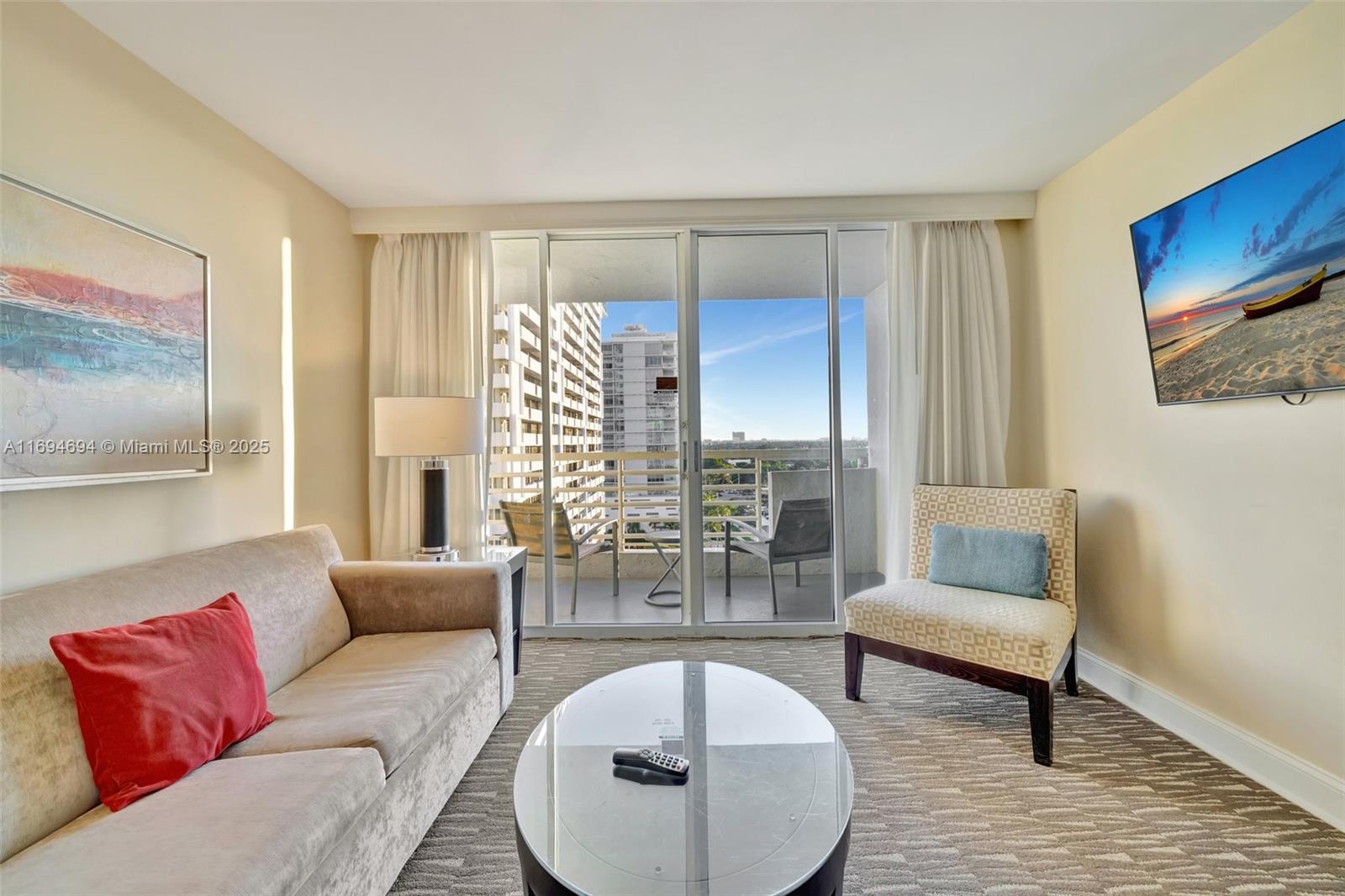 2670 East Sunrise Boulevard, Unit 905 Fort Lauderdale, FL 33304 - Photo 23 of 58 a living room with furniture and a chandelier