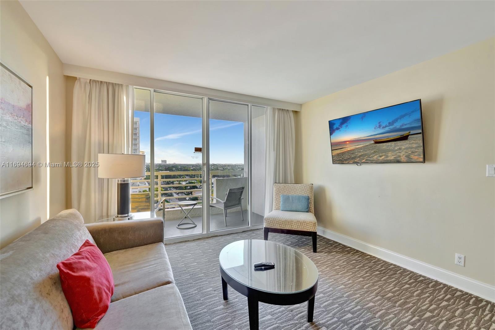 2670 East Sunrise Boulevard, Unit 905 Fort Lauderdale, FL 33304 - Photo 24 of 58 a living room with furniture and a wooden floor