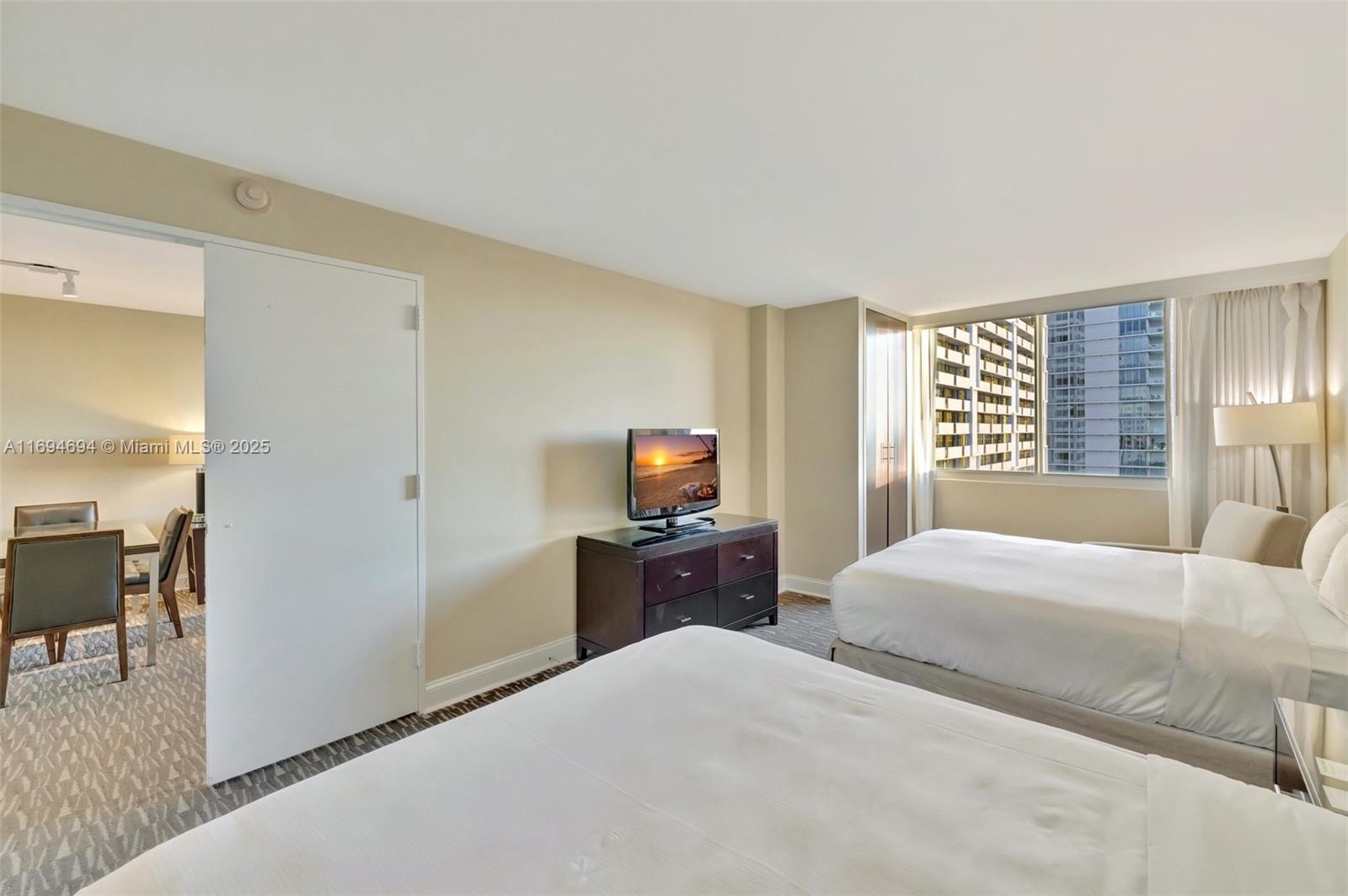 2670 East Sunrise Boulevard, Unit 905 Fort Lauderdale, FL 33304 - Photo 37 of 58 a bedroom with a bed and wooden floor