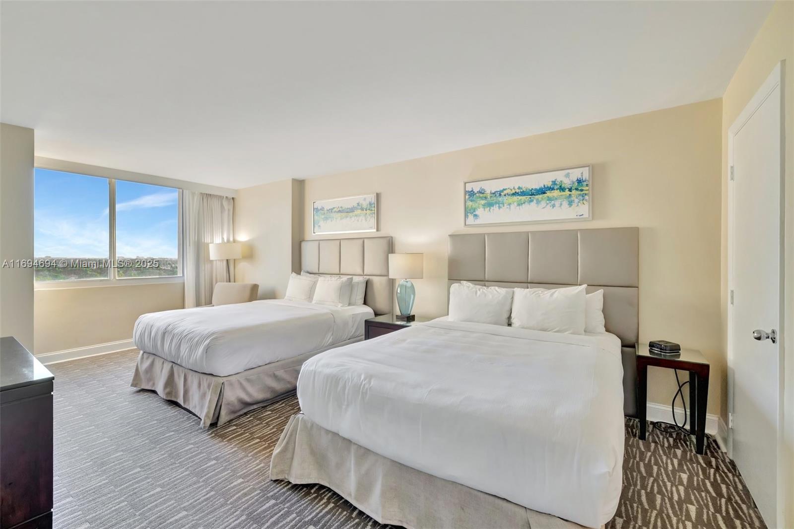 2670 East Sunrise Boulevard, Unit 905 Fort Lauderdale, FL 33304 - Photo 6 of 58 a bedroom with two beds and a table