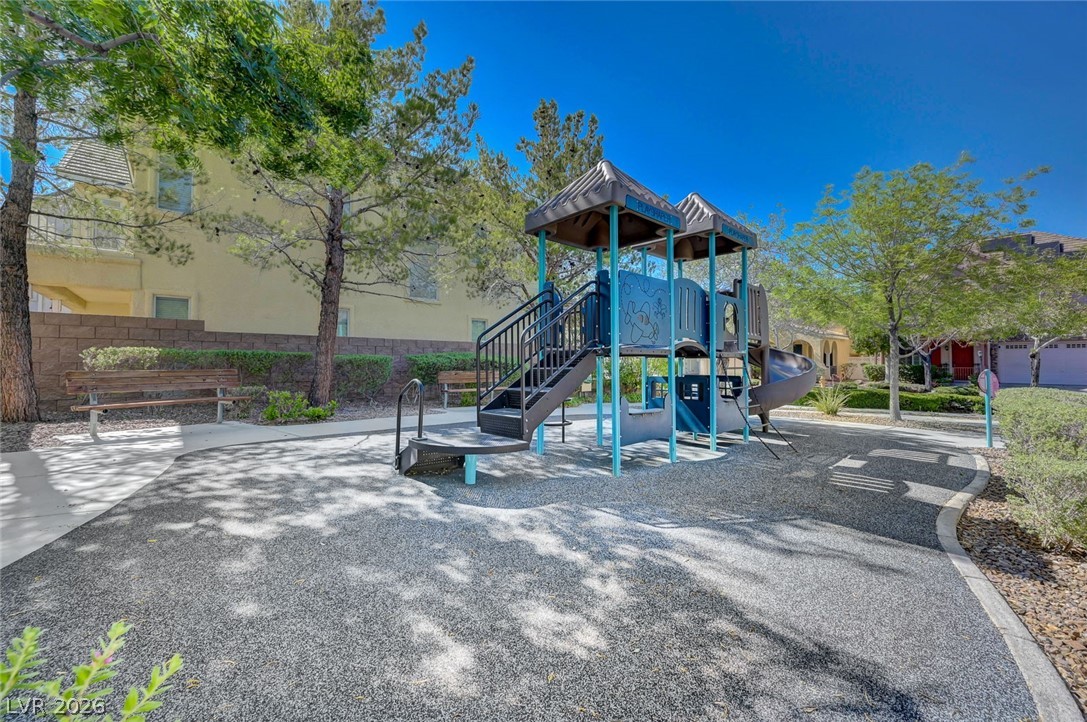 977 Sparkling Light Street Henderson, NV 89052 - Photo 12 of 75 An inviting playground awaits, offering recreation within a vibrant community setting.