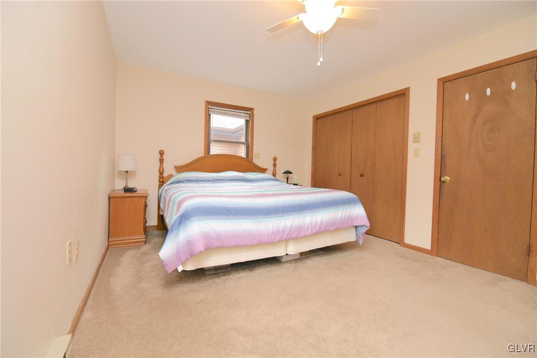 175 Scenic Drive Albrightsville, PA 18210 - Photo 10 of 24 a bedroom with a bed and a chandelier