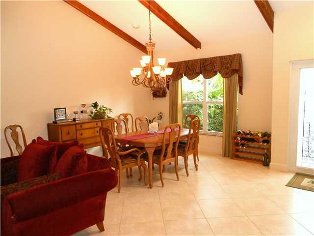 20989 Solano Way Boca Raton, FL 33433 - Photo 6 of 17 a dining room with furniture and a floor to ceiling window