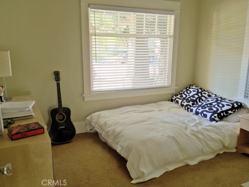 308 Coronado Avenue Long Beach, CA 90814 - Photo 6 of 10 a bedroom with a bed and a window